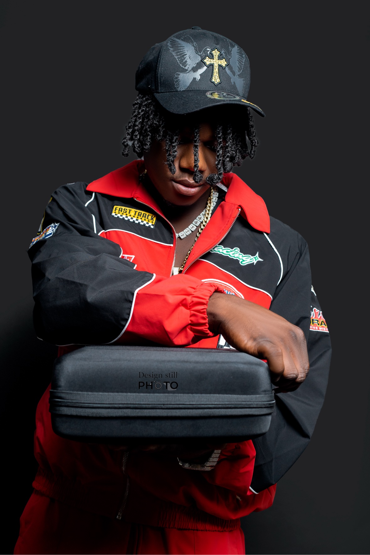 Studio portrait in a red and black racing outfit